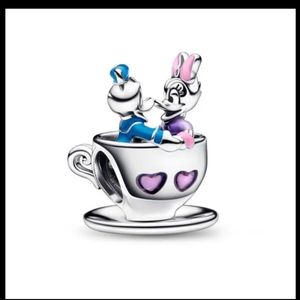 Donald and Daisy duck in a teacup